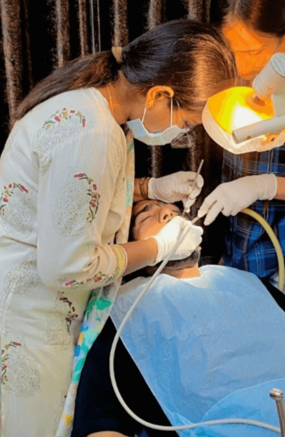 Dr. Anju D. Sahare (BDS, MDS) performing dental treatment at Smile Care Centre, Phagwara